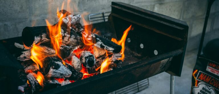 flaming charcoal on black grill